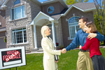 Denver realtor shaking hands with first time home-buyer.